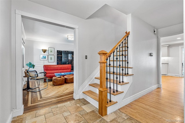 stairs with hardwood / wood-style flooring