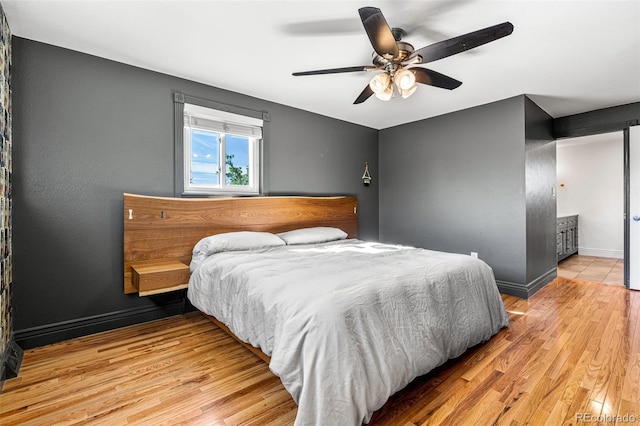 bedroom featuring light hardwood / wood-style floors and ceiling fan