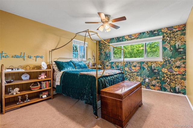 carpeted bedroom with ceiling fan and multiple windows