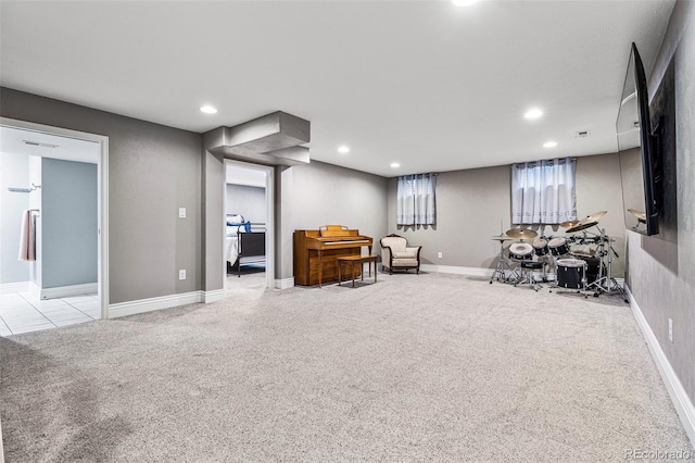 sitting room featuring light colored carpet