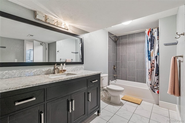 full bathroom featuring vanity, shower / tub combo with curtain, a textured ceiling, and toilet