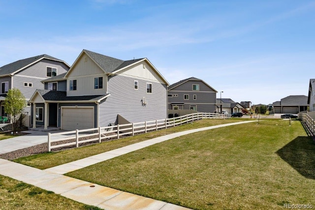 view of side of property with a lawn, fence, board and batten siding, concrete driveway, and an attached garage