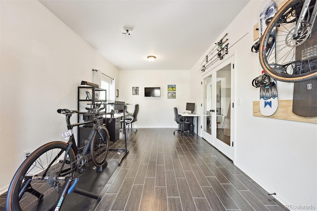 exercise room featuring french doors and wood finish floors