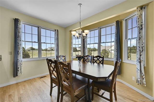 41479 Countryside Cir, Parker, CO 80138 - dining area featuring a chandelier and light wood-style flooring