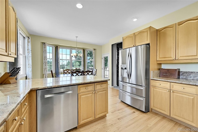 41479 Countryside Cir, Parker, CO 80138 - kitchen with stainless steel appliances, light brown cabinets, light wood-style flooring, a peninsula, and recessed lighting