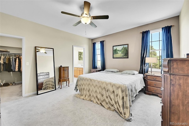 41479 Countryside Cir, Parker, CO 80138 - carpeted bedroom with a spacious closet, a closet, ensuite bathroom, and a ceiling fan