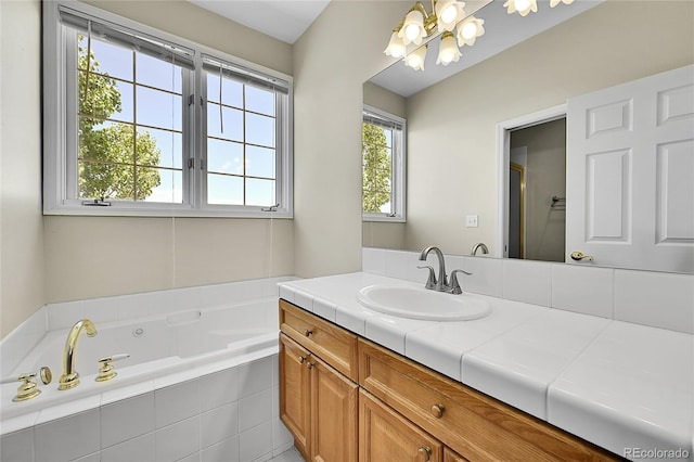 41479 Countryside Cir, Parker, CO 80138 - bathroom with a chandelier, vanity, healthy amount of natural light, and a tub with jets