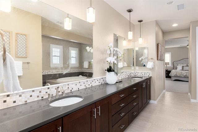 bathroom with tile patterned flooring and vanity