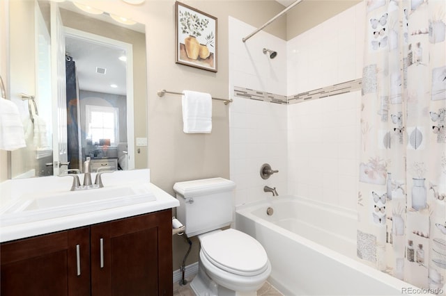 full bathroom featuring vanity, toilet, and shower / bath combination with curtain