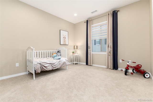 bedroom featuring light colored carpet