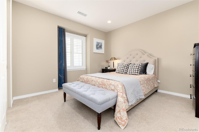 bedroom with light carpet