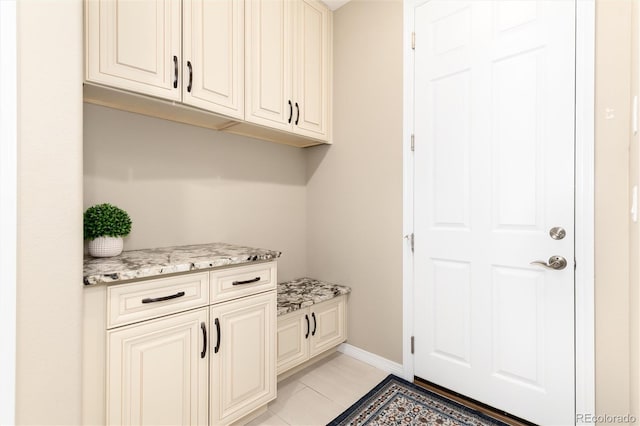 laundry room featuring light tile patterned floors