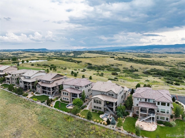 birds eye view of property featuring a mountain view