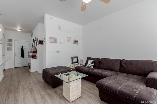 9185 Wilde Ln Unit 101, Parker, CO 80134 - living room with light wood-style floors, a ceiling fan, and baseboards