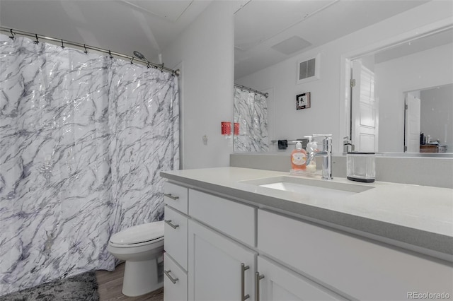9185 Wilde Ln Unit 101, Parker, CO 80134 - full bath with toilet, vanity, and wood finished floors