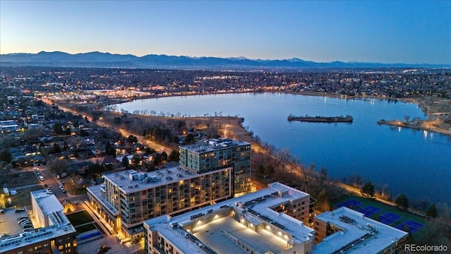 aerial view at dusk with a water and mountain view