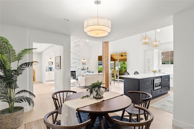5944 E Irwin Pl, Centennial, CO 80112 - dining space with light wood finished floors and recessed lighting
