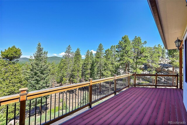 wooden terrace with a mountain view