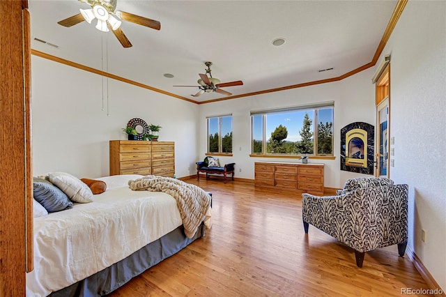 bedroom featuring ceiling fan, wood-type flooring, and ornamental molding