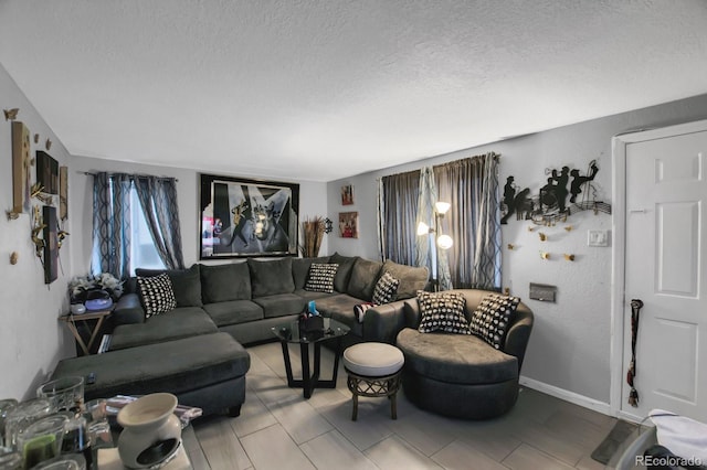 living room with a textured ceiling