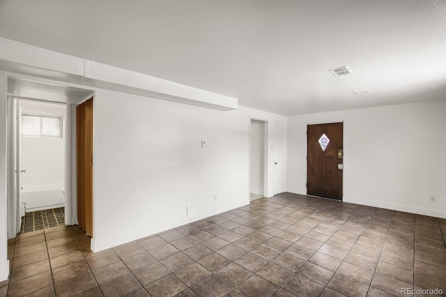 foyer featuring tile patterned flooring