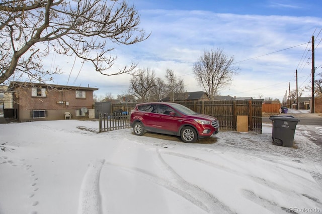 view of snow covered parking