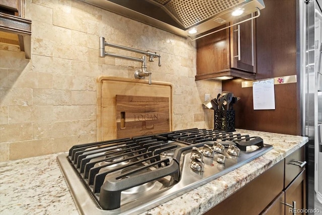 17102 W 85th Pl, Arvada, CO 80007 - kitchen with stainless steel gas cooktop and light stone counters