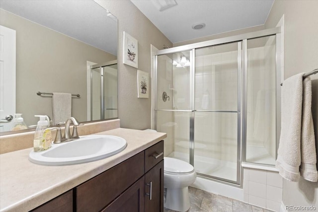 17102 W 85th Pl, Arvada, CO 80007 - bathroom featuring a stall shower, toilet, and vanity