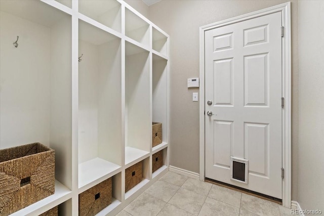 17102 W 85th Pl, Arvada, CO 80007 - mudroom featuring baseboards and light tile patterned floors