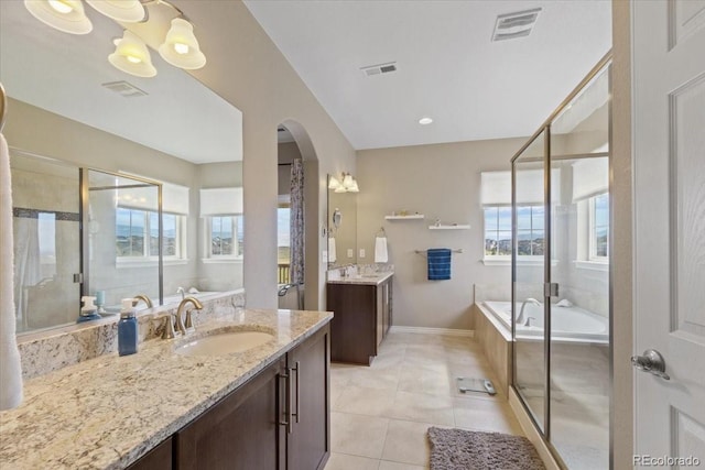 17102 W 85th Pl, Arvada, CO 80007 - full bath with a garden tub, two vanities, tile patterned flooring, and a stall shower
