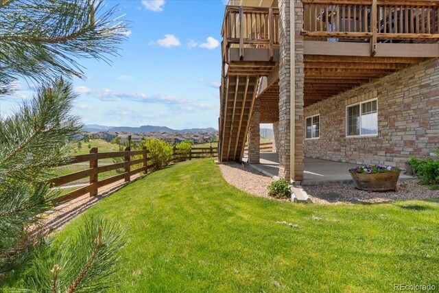 17102 W 85th Pl, Arvada, CO 80007 - view of yard featuring a patio and a deck with mountain view