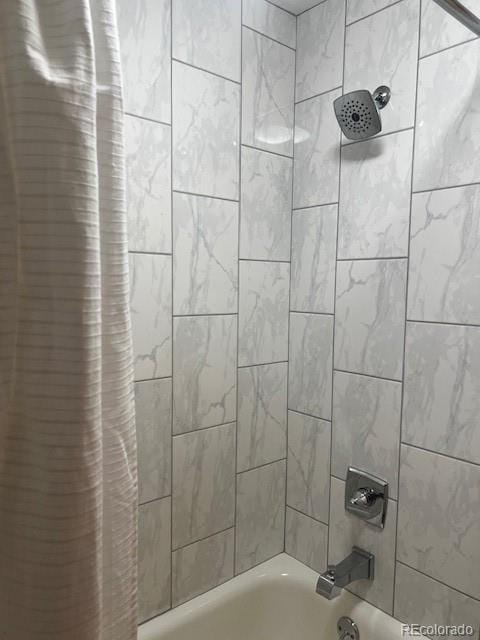 full bathroom with shower / tub combo with curtain