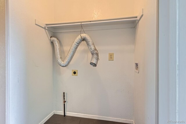 laundry area featuring tile patterned floors, washer hookup, electric dryer hookup, laundry area, and baseboards