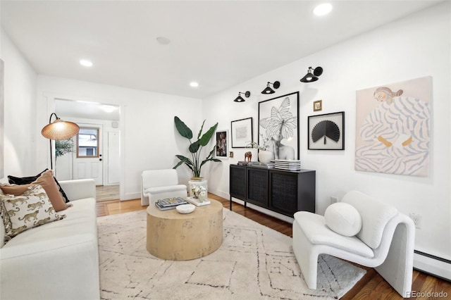 living room with hardwood / wood-style floors and baseboard heating