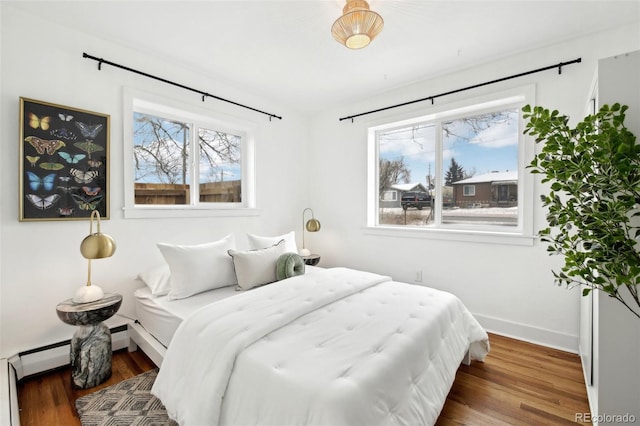 bedroom featuring dark hardwood / wood-style flooring