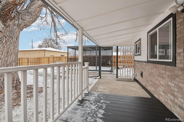 view of snow covered deck