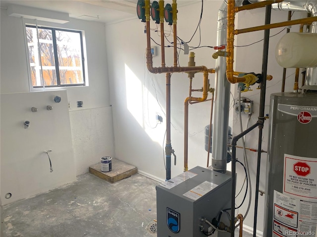 utility room featuring water heater