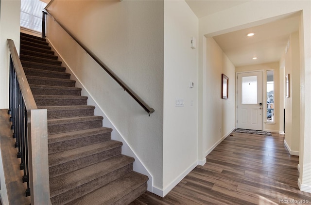 foyer entrance with dark hardwood / wood-style floors