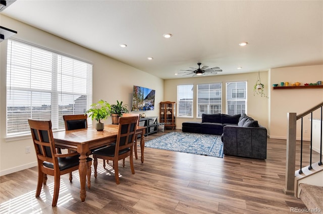 dining area with hardwood / wood-style flooring, ceiling fan, and a healthy amount of sunlight