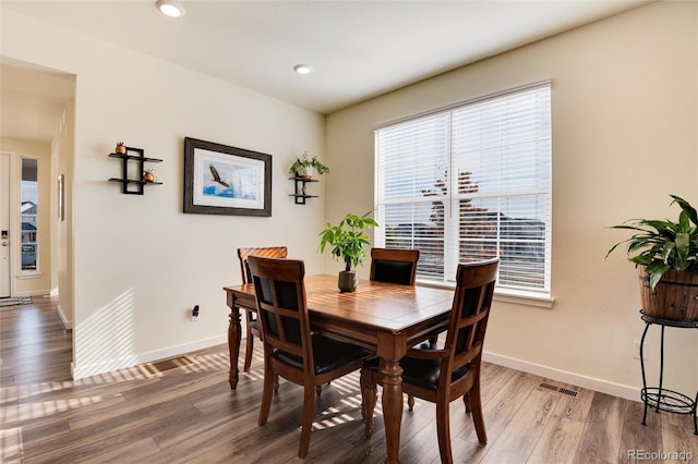 dining area featuring hardwood / wood-style floors