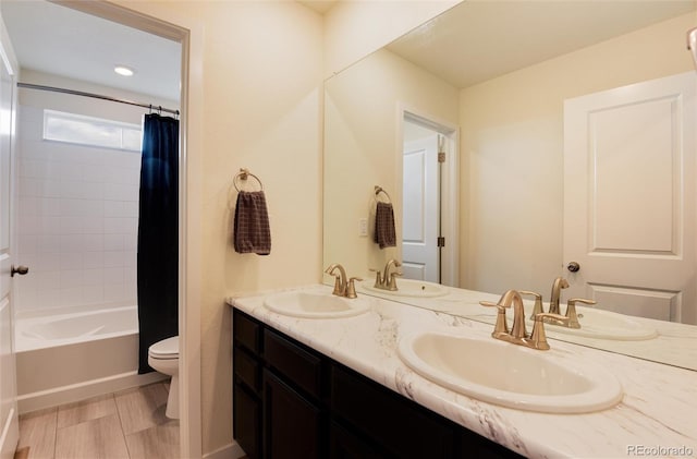 full bathroom featuring vanity, toilet, and shower / bath combo with shower curtain