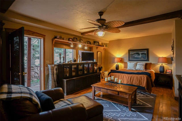 bedroom with ceiling fan and wood-type flooring