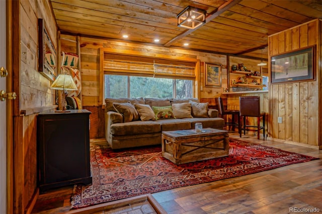 living room featuring wood walls, hardwood / wood-style floors, and wooden ceiling