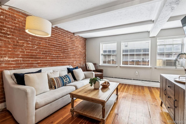 160 Jackson St Unit 5, Denver, CO 80206 - living area featuring baseboard heating, brick wall, light wood finished floors, plenty of natural light, and beam ceiling