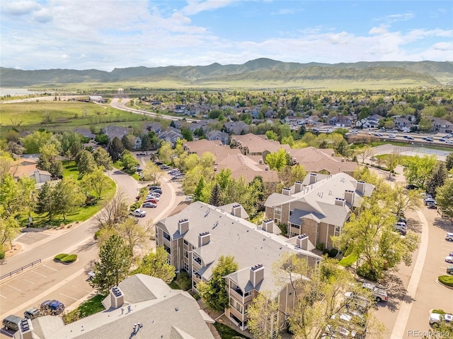 aerial view of residential area featuring a mountain backdrop