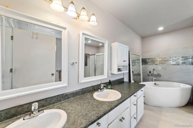 1882 N Rough Rock Ln, Pueblo West, CO 81007 - full bath with double vanity, a freestanding bath, and a shower