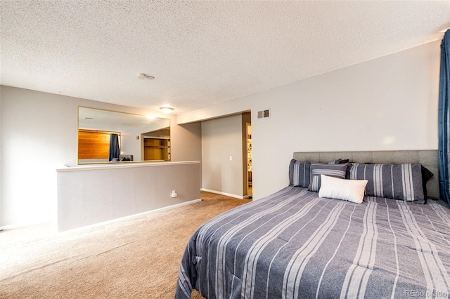 2459 S Xanadu Way Unit B, Aurora, CO 80014 - carpeted bedroom with a textured ceiling