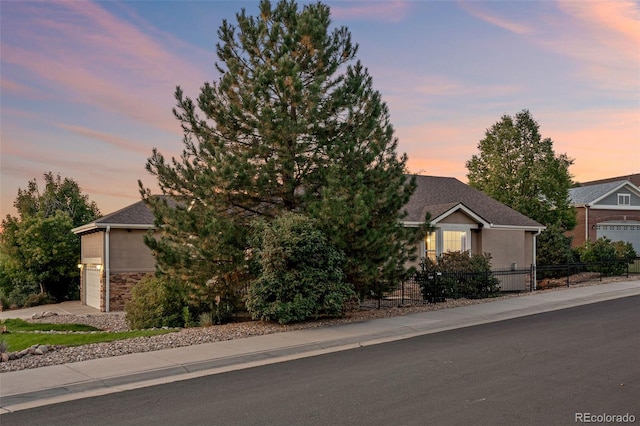 obstructed view of property featuring a garage