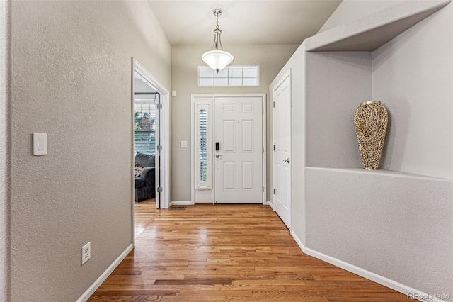 foyer with light hardwood / wood-style flooring