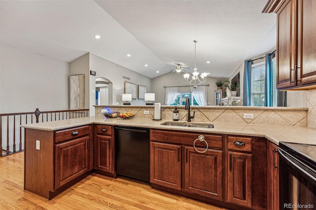 kitchen featuring vaulted ceiling, black dishwasher, kitchen peninsula, light hardwood / wood-style flooring, and sink